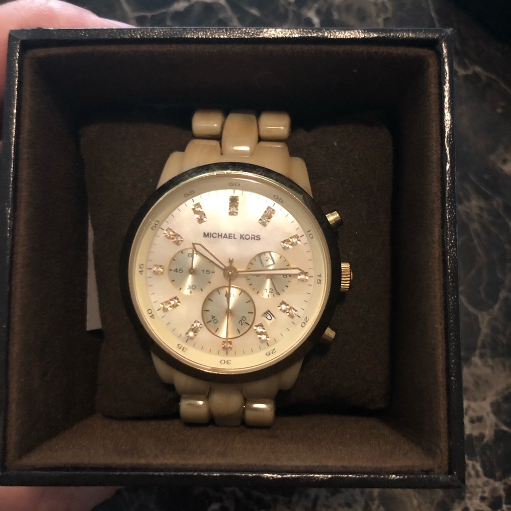 Micheal kora tan/gold ceramic watch.
